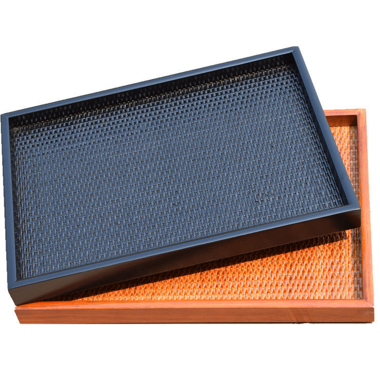 Small rattan tray on a bedside table