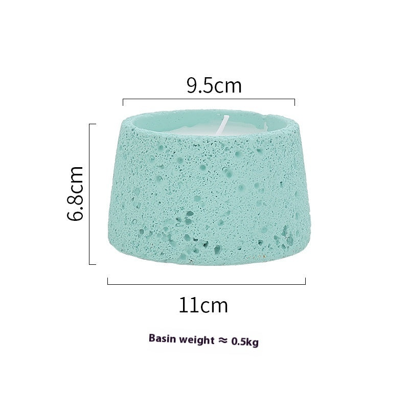 Black tealight holder with lit tealight